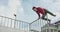 Stuntman doing flips on a skateboard track outdoors