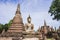 Stupa and Buddha Statue in Wat Mahathat Temple, Sukhothai Historical Park, Thailand