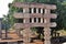 Stupa No 1, South Gateway. Rear Architrave and lion capitals on pillars. Broken Asoka pillar also seen in. background.