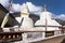 Stupa with prayer flags and wheels