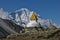 Stupa and snow capped mountain Thamserku