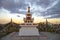 Stupa on the territory of the hurula Syakyusn-Syume on the background of sunset. Elista
