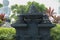 Stupas arrangement on stairs at Borobudur buddhist temple. Black stone bells in Brahmavihara arama temple, Bali, Indonesia