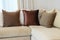 Sturdy brown sofa with brown patterned pillows