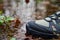 Sturdy Hiking Boots in Puddle on Forest Trail