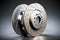 sturdy metal brake discs for cars on gray background