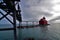 Sturgeon pier head light and walkway across the frozen pier in Winter on the shipping canal to lake Michigan