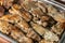 Sturgeon steaks baked on charcoal, laid out on a baking sheet. Iron pan with fish, blanks for catering.