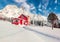 Stuuning winter view of Vestvagoy island with typical norwegian wooden red house, Norway, Europe.