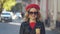 The style of a gentle and daring Parisian woman. Red beret, black sunglasses, biker jacket. Portrait