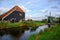 Style houses and windmills in Holland. Rural atmosphere at Zaanse Schans, Zaandam,