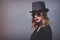 Style and mystique redhead girl in top hat and sunglasses