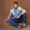 Style, smile and portrait of man in studio with trendy, stylish and classy suit with confidence. Happy, model and