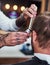 We style your hair exactly how you like it. an unrecognizable man getting a haircut at a barbershop.