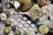 Styled still life with white wooden runes, yellow flowers and magic crystal ball with ritual objects on witch table