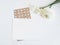 Styled stock photo. Feminine digital product mockup with buttercup and daffodil flowers, and blank list of paper . White