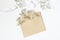 Styled stock photo. Feminine wedding desktop mockup with baby`s breath Gypsophila flowers, satin ribbon and blank craft