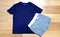Styled Stock Photography, Blue kids T-shirt and Grey shorts Mock up on light Wooded background