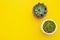 Styled work space. Echeveria Succulent Flower Plants on yellow background. Copy space. Flat lay, top view