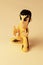 Stylised Bruce Lee toy in the famous yellow tracksuit