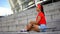 Stylish afro-american girl with skateboard sitting outdoors, youth subculture