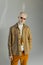 stylish albino model in sunglasses and