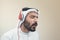 Stylish Arabian man in headphones, Arabian guy listening to music
