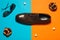 Stylish arty hipster fashion concept in avant-garde style. Trendy eyewear and leather footwear on blue and orange background with