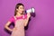 stylish asian female model with megaphone on purple