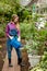 Stylish awesome woman taking care of flowers