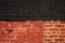 Stylish background of wall with black and red brick