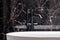 Stylish black bathtub faucet, close-up