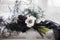 Stylish black bouquet tied with a black ribbon on a white cloth