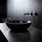 Stylish black marble round vessel sink and wall mounted faucet on stone wall. Interior design of modern bathroom. Created with