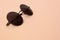 Stylish black sunglasses with round glasses lies on a blanket made of soft and fluffy light orange fleece fabric. Fashionable