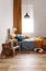 Stylish blue and orange kid`s bedroom design in bright apartment