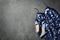 Stylish blue palette dress and shoes on grey stone background, flat lay