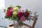 Stylish bouquet of flowers from gerberas, Burgundy roses, orchids, tulips