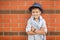 Stylish boy in the street near his home