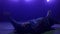 Stylish breakdancer moving body lying dance floor in club ultraviolet lights.