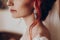 Stylish bride detail, luxury earring and red hair curl, beautiful wedding dress. rustic wedding morning preparation. bridal