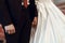 stylish bride and groom holding hands at wedding ceremony in church. spiritual couple. space for text.