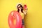 Stylish brunette girl on vacation, taking selfie with swim ring, going on beach, swimming in sea on summer holiday