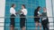 Stylish business women standing on terrace and talking to each other on business topics