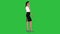Stylish businesswoman walking on meeting and calling to client on a Green Screen, Chroma Key.