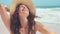 Stylish casual woman enjoying sun at tropical beach