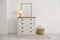 Stylish chest of drawers in living room