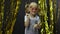 Stylish child dancing, make faces, waving hand in silly dance. Little blonde kid girl 4-5 years old