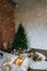 Stylish Christmas interior, bedroom with a lot of lights. Comfort home in a loft style with a decorated Christmas tree and a