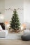 Stylish christmas interior with christmas tree, stars, gifts and decoration. Minimal xmas interior design template